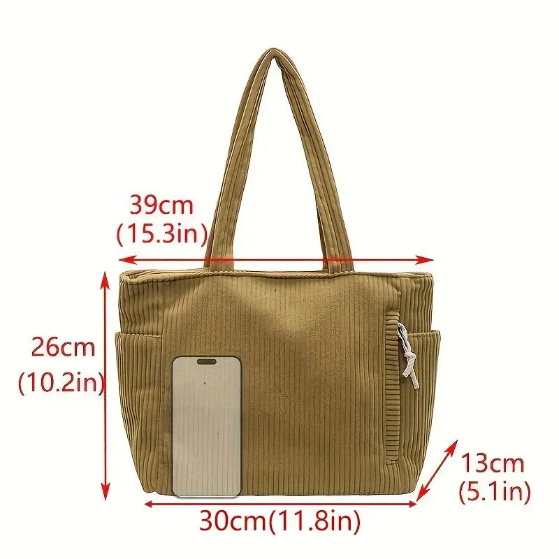 The new corduroy tote bag is a simple, large-capacity, versatile, casual student shoulder bag for class and commuting