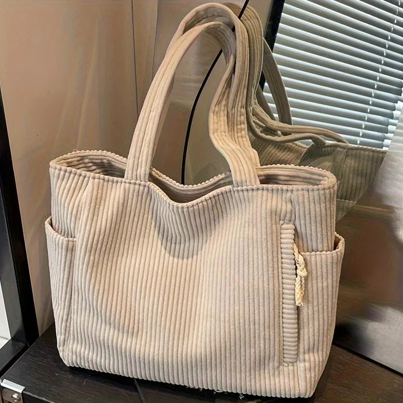 The new corduroy tote bag is a simple, large-capacity, versatile, casual student shoulder bag for class and commuting