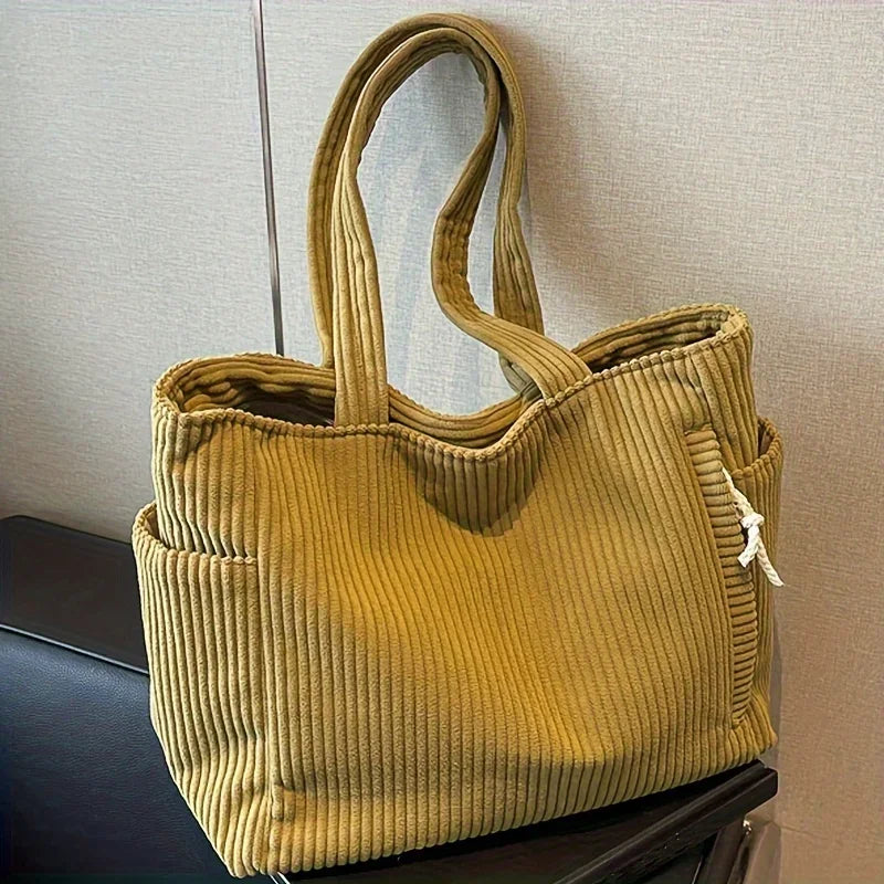 The new corduroy tote bag is a simple, large-capacity, versatile, casual student shoulder bag for class and commuting